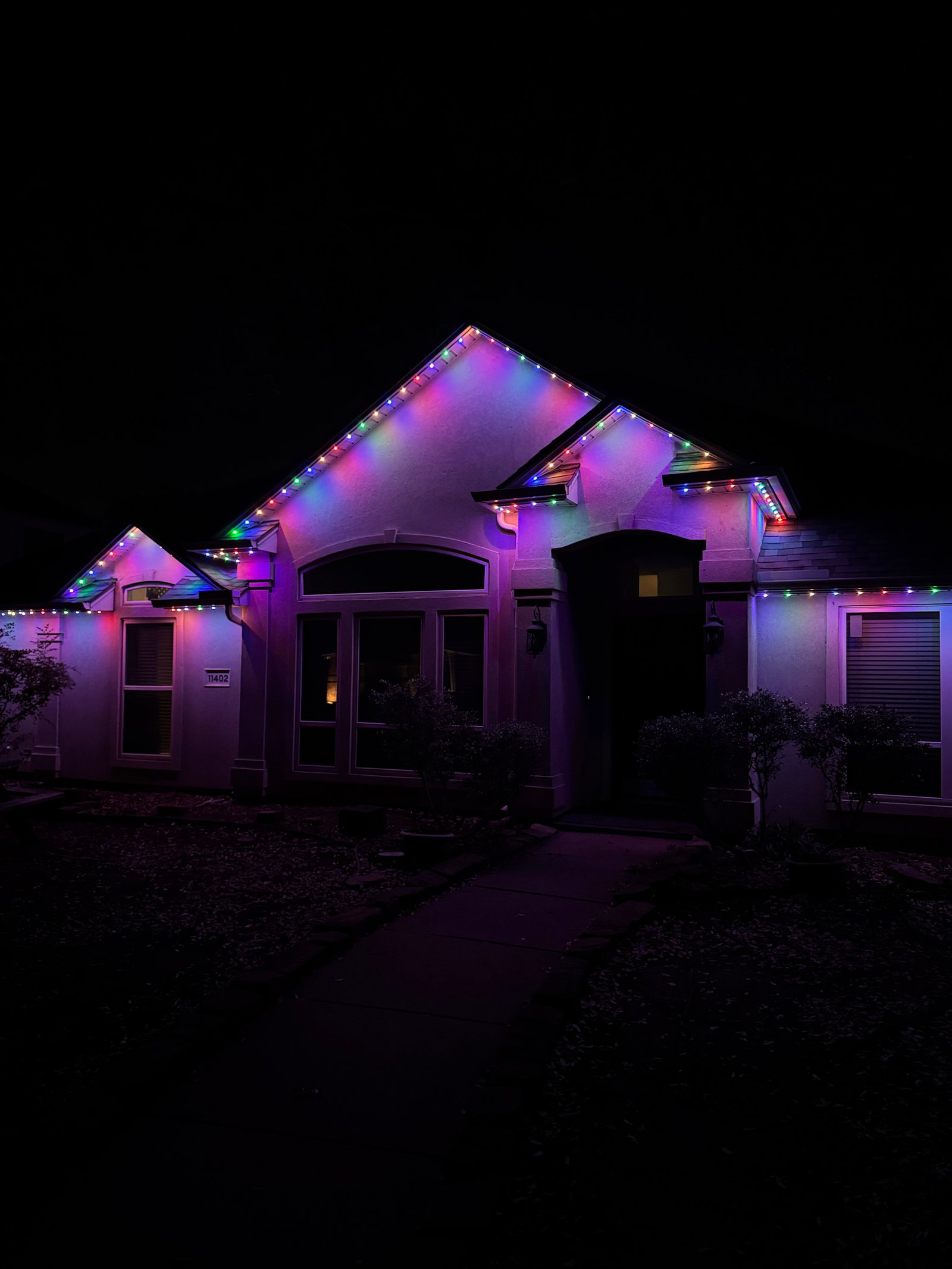 Frisco Texas home with permanent white LED soffit lights on for Christmas holiday display
