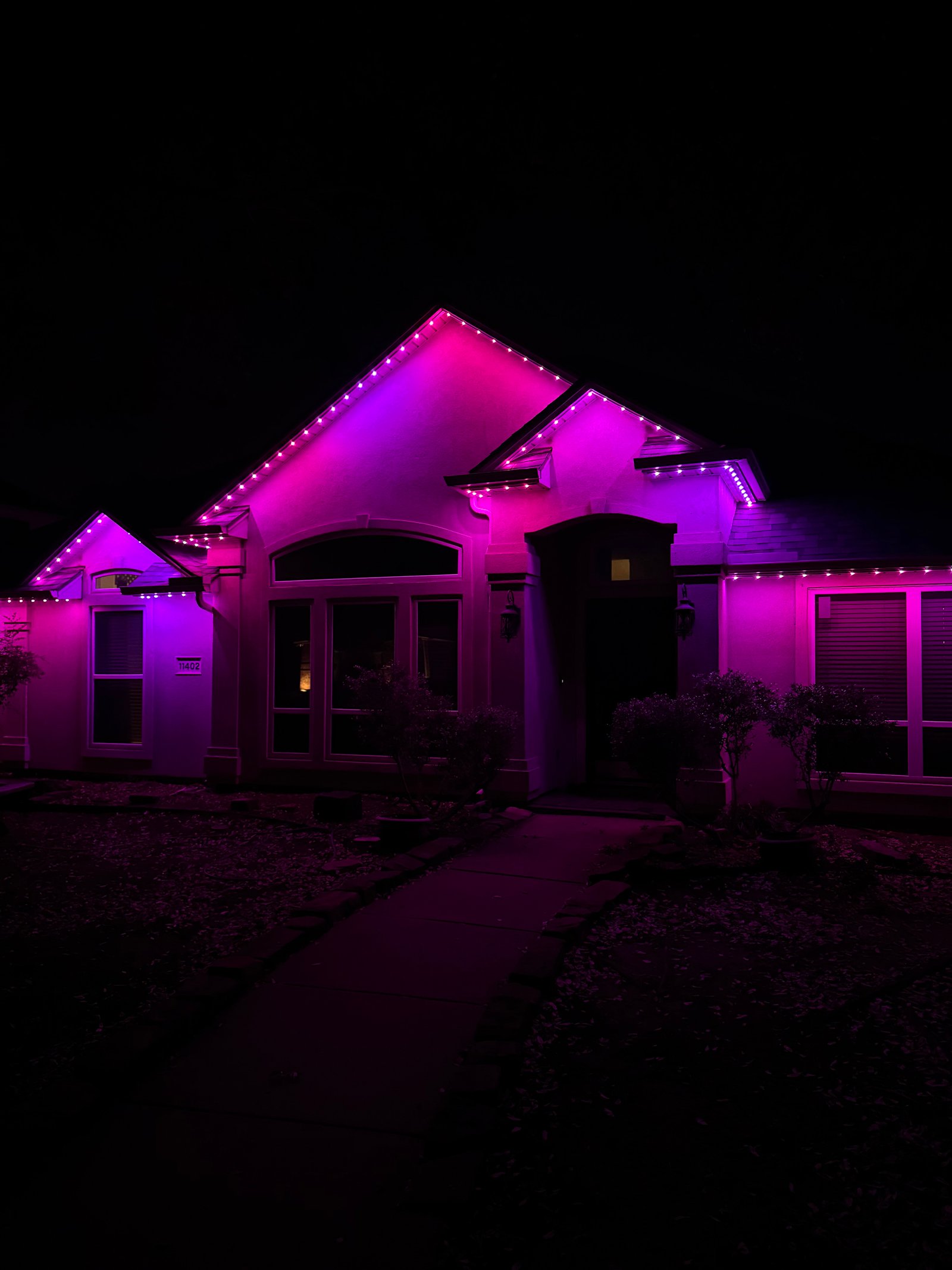 Plano Texas home with permanent blue and white Celebright LED lights for 4th of July